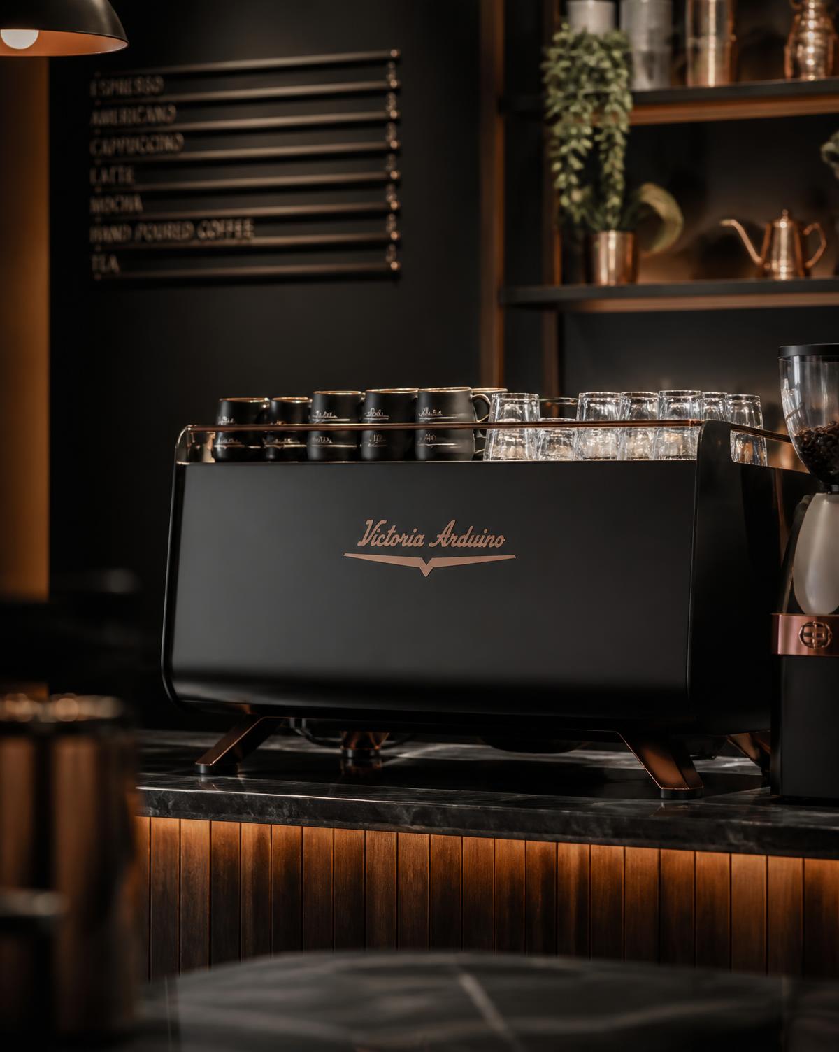 Victoria Arduino commercial espresso machine on a marble counter
